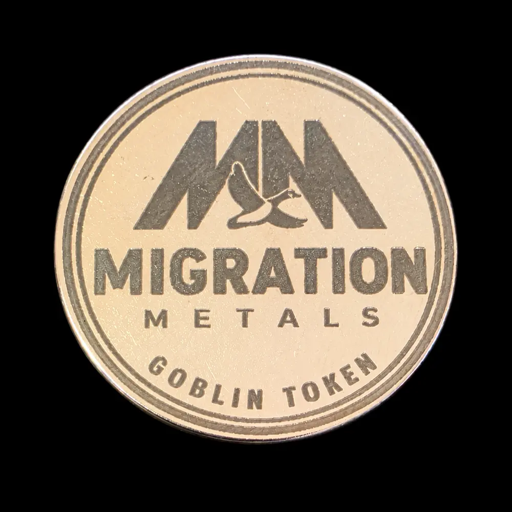 32 mm laser-engraved token by TxLooT: Migration Metals · branded token